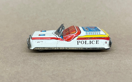 Tin Litho FRICTION Police car- Made in Japan 1950s - Friction sound works - Original Tires - Car runs but not far Police equipment in litho