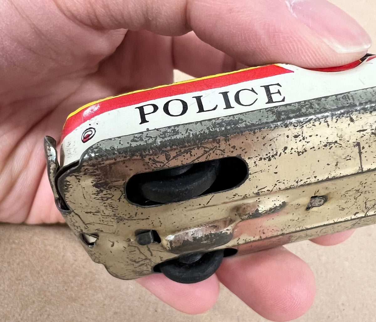Tin Litho FRICTION Police car- Made in Japan 1950s - Friction sound works - Original Tires - Car runs but not far Police equipment in litho