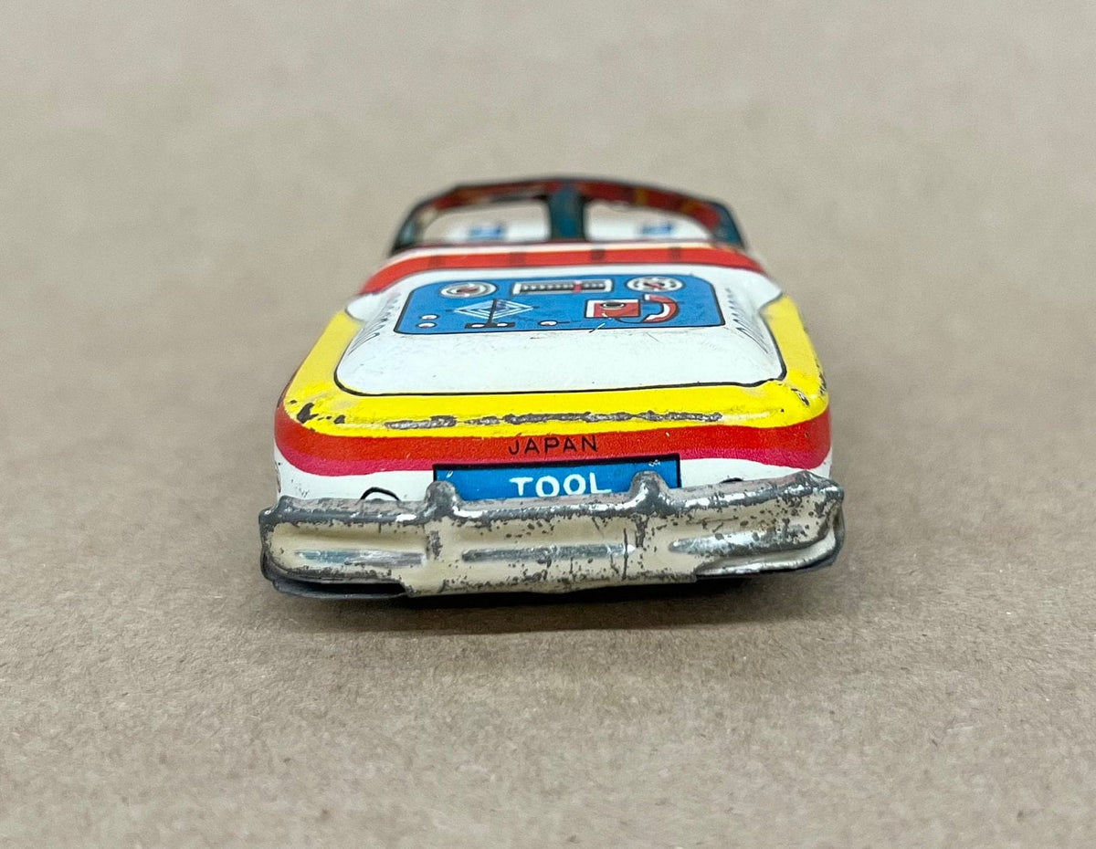 Tin Litho FRICTION Police car- Made in Japan 1950s - Friction sound works - Original Tires - Car runs but not far Police equipment in litho