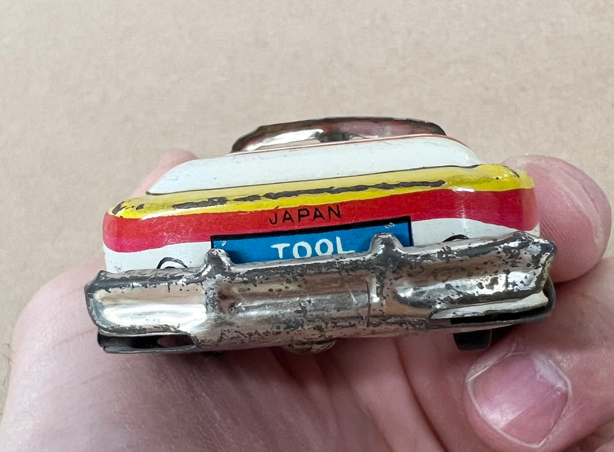 Tin Litho FRICTION Police car- Made in Japan 1950s - Friction sound works - Original Tires - Car runs but not far Police equipment in litho