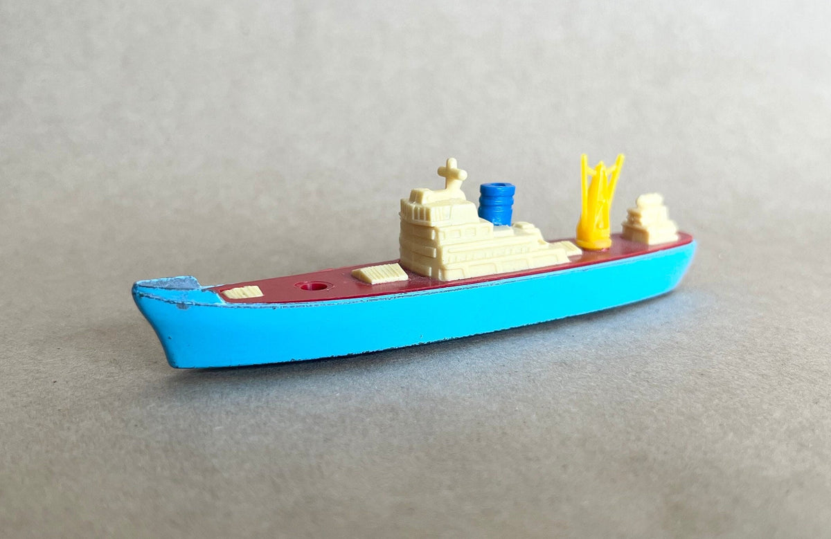 Metal Die Cast Cargo Ship in Blue Color- Tootsie Toy-1960's- Missing one small piece - original wheels in working condition - unusual color