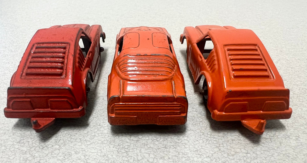 Tootsie Toy Set Of Three- Orange Pontiac Firebird And 2 Ford Mustangs Sold as a set.