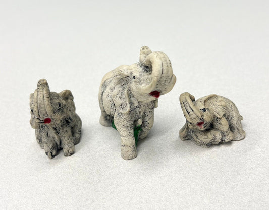 Carved Stone Elephants  - Set of three - Mother Elephant and two Young Elephants - One Elephant Sitting, one Lounging - Realistic Elephants