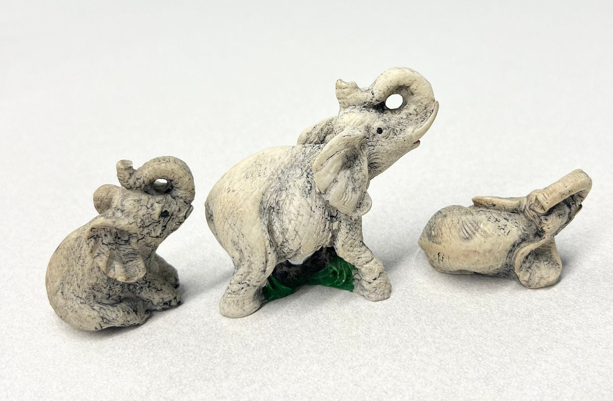 Carved Stone Elephants  - Set of three - Mother Elephant and two Young Elephants - One Elephant Sitting, one Lounging - Realistic Elephants