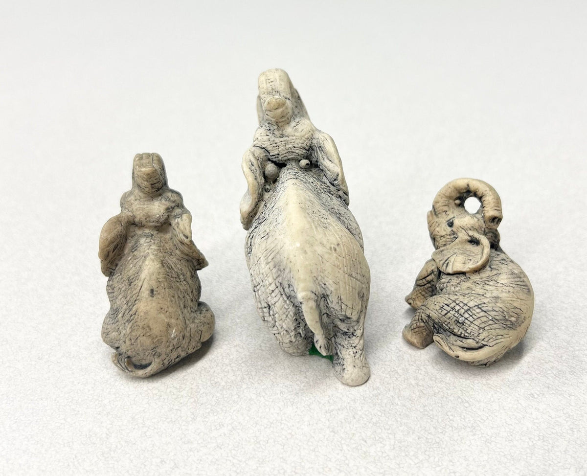 Carved Stone Elephants  - Set of three - Mother Elephant and two Young Elephants - One Elephant Sitting, one Lounging - Realistic Elephants