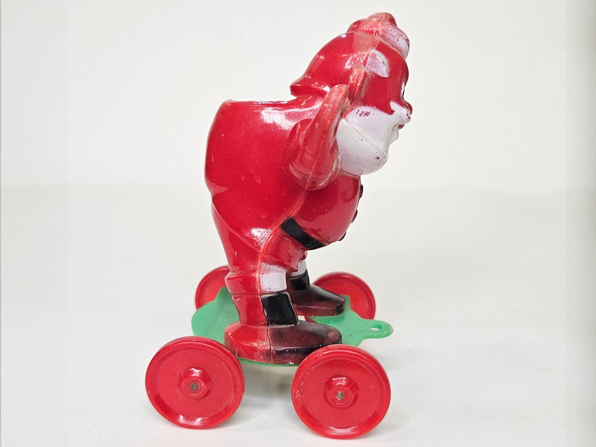 1950's Rosbro - Santa On Wheels Pull Toy and Candy Container - Hard Plastic Santa Candy Container -  Missing  Christmas stocking on Rt Hand